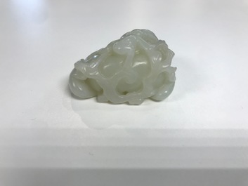 A Chinese celadon jade carving of two monkeys on a peach, 19th C.