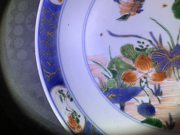 A pair of Chinese famille verte 'ducks in a lotus pond' plates, Kangxi