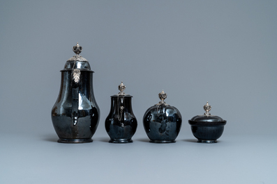 A four-piece silver-mounted Namur black-glazed pottery coffee service, 18th C.