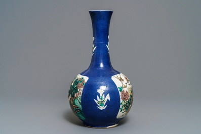 A Chinese famille verte powder blue-ground bottle vase, 19th C.