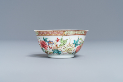 A fine Chinese famille rose cup and saucer with flowers and insects, Yongzheng