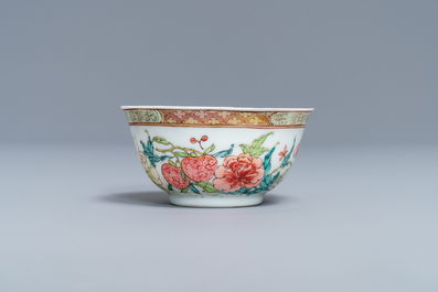 A fine Chinese famille rose cup and saucer with flowers and insects, Yongzheng