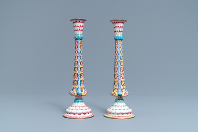 A pair of Chinese Canton enamel candlesticks with floral design, Yongzheng