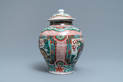 A Chinese wucai &lsquo;mythical beasts&rsquo; vase and cover, Transitional period