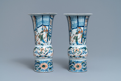 A pair of polychrome Dutch Delft chinoiserie beaker vases, 18th C.