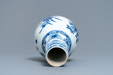 A Chinese blue and white bottle vase, Kangxi mark, 19th C.