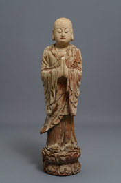 A Chinese painted wood figure of a Buddhist monk, 19th C.