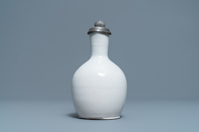 A white Dutch Delft jug with pewter cover, 17th C.