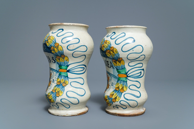 A pair of Italian maiolica armorial albarelli, Deruta, dated 1562