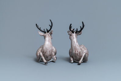 A pair of large Chinese aubergine-glazed models of recumbent deer, 18/19th C.