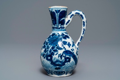 Three Dutch Delft blue and white vases and a chinoiserie jug, 17/18th C.