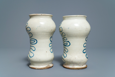 A pair of Italian maiolica armorial albarelli, Deruta, dated 1562