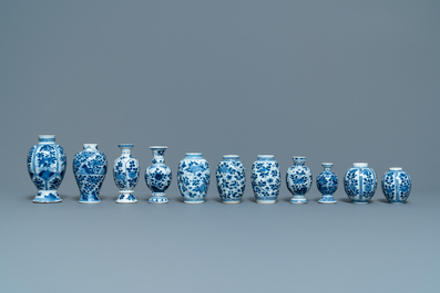 Eleven small Chinese blue and white vases with floral design, Kangxi