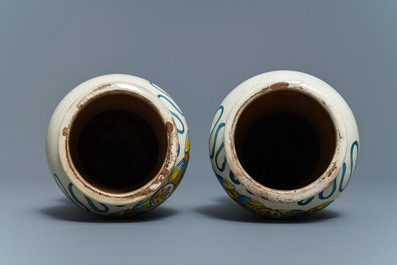 A pair of Italian maiolica armorial albarelli, Deruta, dated 1562