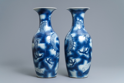 A pair of Chinese blue and white 'dragon and carp' vases, 19th C.