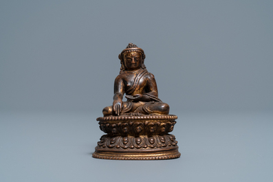 A Sino-Tibetan gilt bronze figure of Buddha, 16/17th C.