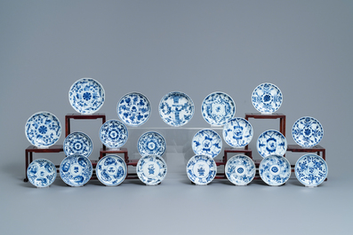 A collection of 22 Chinese blue and white cups and 32 saucers, Kangxi/Qianlong