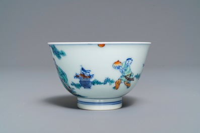 A Chinese doucai bowl with figures in a landscape, Kangxi mark, 19/20th C.