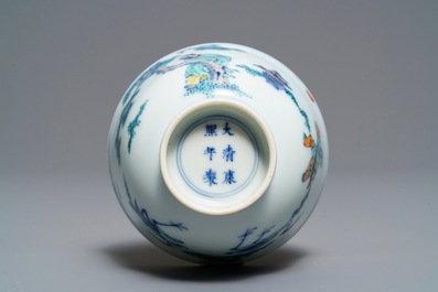 A Chinese doucai bowl with figures in a landscape, Kangxi mark, 19/20th C.