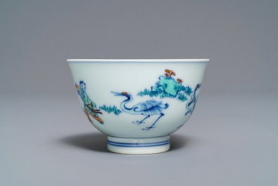 A Chinese doucai bowl with figures in a landscape, Kangxi mark, 19/20th C.