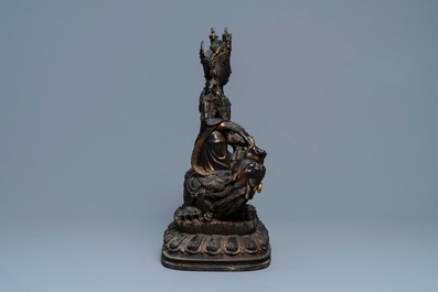 A large Chinese bronze group of Guanyin on a dragon, prob. Ming