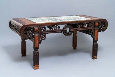 A large Chinese famille rose plaque inset in a wooden table, Republic, 20th C.