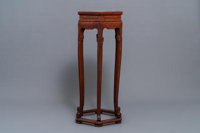 A Chinese wooden stand with marble top, 19/20th C.