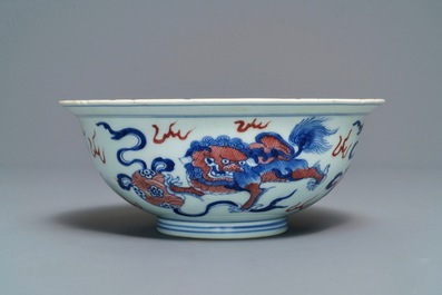 A Chinese blue, white and underglaze red 'Buddhist lion' bowl, Qianlong mark and of the period