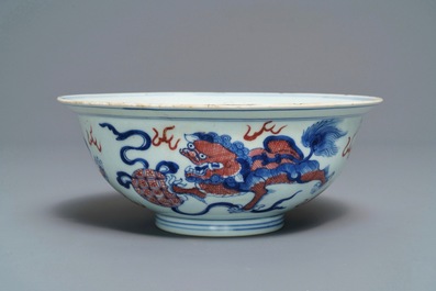 A Chinese blue, white and underglaze red 'Buddhist lion' bowl, Qianlong mark and of the period