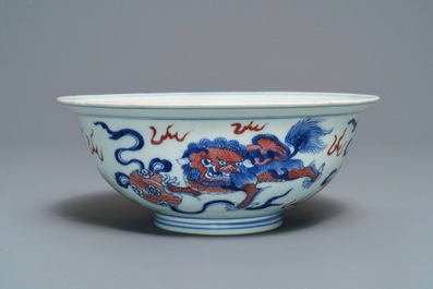 A Chinese blue, white and underglaze red 'Buddhist lion' bowl, Qianlong mark and of the period