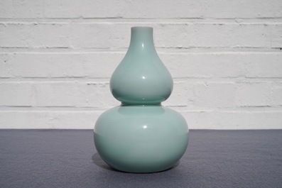 A Chinese monochrome celadon double gourd vase, Qianlong mark, 19th C.