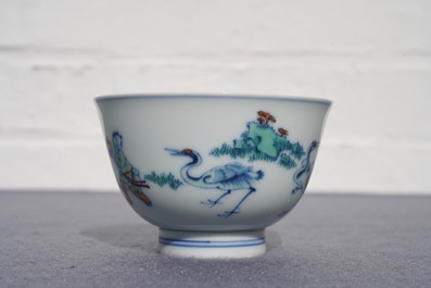 A Chinese doucai bowl with figures in a landscape, Kangxi mark, 19/20th C.