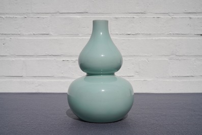 A Chinese monochrome celadon double gourd vase, Qianlong mark, 19th C.