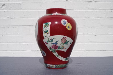 A fine Chinese famille rose ruby ground baluster vase with floral panels, Yongzheng