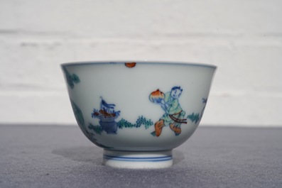 A Chinese doucai bowl with figures in a landscape, Kangxi mark, 19/20th C.