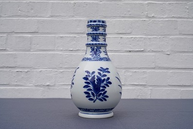 A Chinese blue and white bottle vase, Kangxi mark, 19th C.