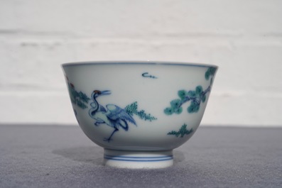 A Chinese doucai bowl with figures in a landscape, Kangxi mark, 19/20th C.