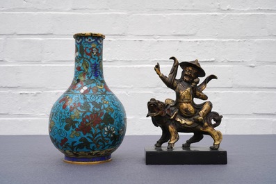 A Chinese cloisonn&eacute; bottle vase and a gilt bronze group, 18/19th C.