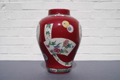 A fine Chinese famille rose ruby ground baluster vase with floral panels, Yongzheng