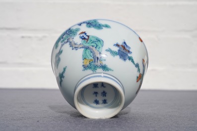 A Chinese doucai bowl with figures in a landscape, Kangxi mark, 19/20th C.