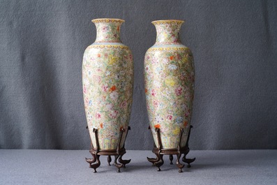 A pair of Chinese famille rose 'millefleurs' eggshell vases, Qianlong mark, Republic, 20th C.