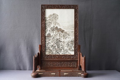 A fine Chinese grisaille 'winter landscape' plaque in a wooden table screen, Republic, 20th C.