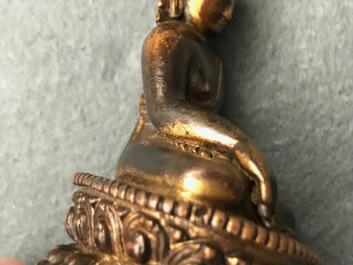 A Sino-Tibetan gilt bronze figure of Buddha, 16/17th C.