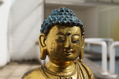 An inscribed Chinese gilt bronze figure of Buddha standing, Qianlong