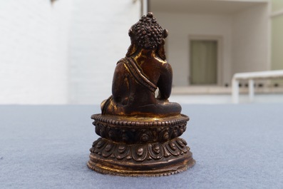 A Sino-Tibetan gilt bronze figure of Buddha, 16/17th C.