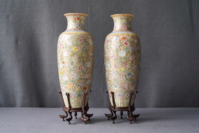 A pair of Chinese famille rose 'millefleurs' eggshell vases, Qianlong mark, Republic, 20th C.