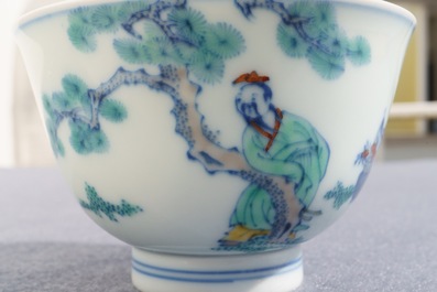 A Chinese doucai bowl with figures in a landscape, Kangxi mark, 19/20th C.