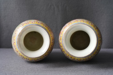 A pair of Chinese famille rose 'millefleurs' eggshell vases, Qianlong mark, Republic, 20th C.