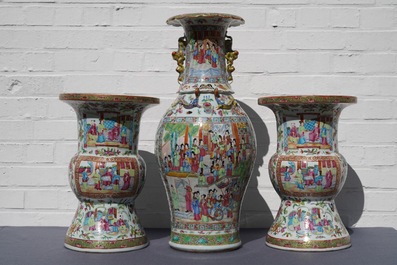 A pair of Chinese Canton famille rose spittoons and a vase, 19th C.