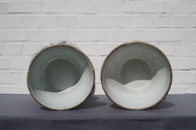 A pair of Chinese Canton famille rose spittoons and a vase, 19th C.